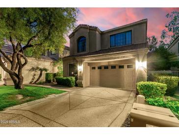 Charming two-story home featuring an attached garage, landscaped yard, and a serene, inviting curb appeal at 7525 E Gainey Ranch Rd # 110, Scottsdale, AZ 85258