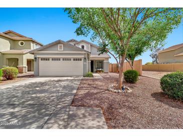 Charming single-Gathering home with a well-maintained front yard and a two-car garage at 34505 N Picket Post Dr, San Tan Valley, AZ 85144