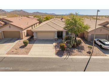 Charming single-story home featuring a xeriscaped front yard and neutral color palette at 41105 N Prestancia Way, Anthem, AZ 85086