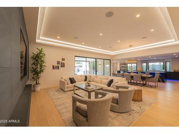 Bright living room boasts recessed lighting, hardwood flooring, and comfortable furniture at 7278 E Echo Ln, Scottsdale, AZ 85258