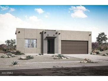 Contemporary one-story home featuring a minimalist desert landscape, a two-car garage, and a modern entrance at 17307 W Via Dona Rd, Surprise, AZ 85387