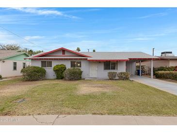 Charming single-story home with a well-maintained front yard and mature landscaping at 1324 W 15Th St, Tempe, AZ 85281