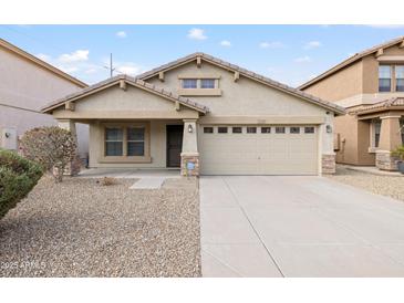 Charming single-story home featuring a two-car garage and low-maintenance desert landscaping at 22610 N 17Th St, Phoenix, AZ 85024