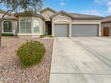 Charming single-Gathering home featuring a well-maintained yard and a spacious two-car garage at 10320 W Cashman Dr, Peoria, AZ 85383