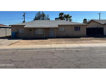 Charming single-story home featuring a covered front porch and desert landscaping at 3211 W Bethany Home Rd, Phoenix, AZ 85017