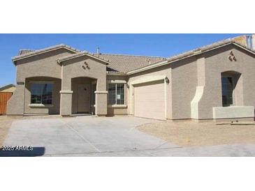 Charming single-story home with desert landscaping and a two-car garage, perfect for comfortable living at 7412 S 15 S Dr, Phoenix, AZ 85041