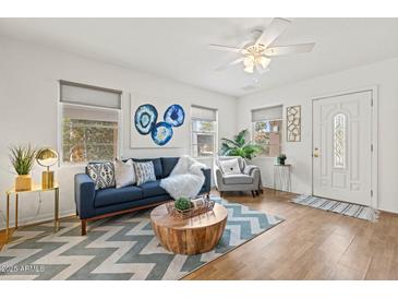 Bright living room with stylish furniture, hardwood floors, and plenty of natural light at 309 W Campbell Ave, Phoenix, AZ 85013