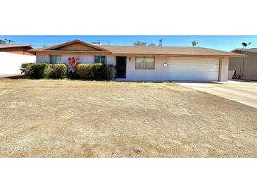 Charming single-story home with a two-car garage and front yard at 3133 N 81St Ave, Phoenix, AZ 85033