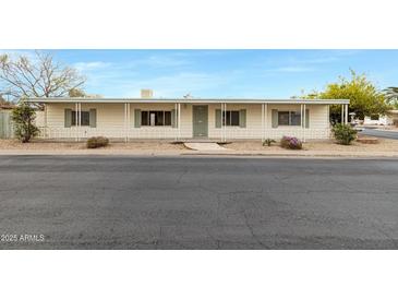 Charming home with a covered porch and lovely curb appeal at 16215 N 35Th Pl, Phoenix, AZ 85032