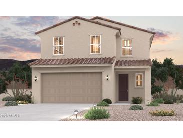 Charming two-story home showcasing a tile roof and a neutral-toned exterior at 17259 W Daley Ln, Surprise, AZ 85387