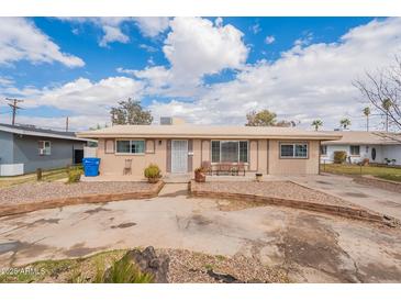 Charming single-story home featuring a quaint front yard and neutral exterior paint at 8531 N 37Th Ave, Phoenix, AZ 85051