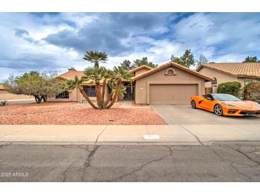 Charming single-story home with well-maintained landscaping and an attached two-car garage at 372 W Larona Ln, Tempe, AZ 85284