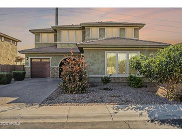 Charming two-story home features neutral colors, well-manicured landscaping, and an attached two-car garage at 3901 S Adobe Dr, Chandler, AZ 85286