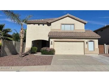 Charming two-story home featuring a spacious two-car garage and well-maintained landscaping at 6780 W Yearling Rd, Peoria, AZ 85383