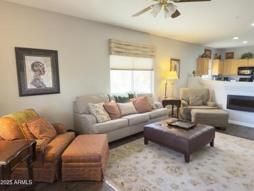 Inviting living room with plush seating, stylish decor, and cozy fireplace creating a relaxing atmosphere at 9750 N Monterey Dr # 67, Fountain Hills, AZ 85268