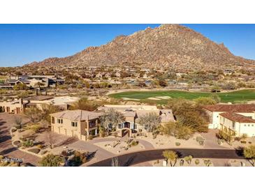 Stunning aerial view of a Southwestern home showcasing mountain views and a golf course at 10801 E Happy Valley Rd # 86, Scottsdale, AZ 85255