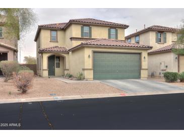Charming two-story home featuring a two-car garage and well-maintained landscaping at 40262 W Molly Ln # 138, Maricopa, AZ 85138