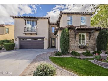 Beautiful two-story stucco home with a tile roof, stone accents, and well-manicured landscaping at 4576 E Waterman St, Gilbert, AZ 85297