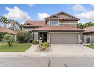 Charming two-story home featuring a well-manicured lawn and a neutral color palette at 5755 W Harrison St, Chandler, AZ 85226