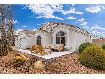 Charming home exterior boasting a cozy patio area and desert-friendly landscaping for a serene ambiance at 7717 E Black Rock Rd, Scottsdale, AZ 85255