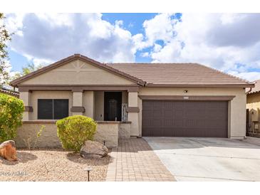 Charming single-story home with a well-manicured front yard and two car garage at 11831 W Daley Ct, Sun City, AZ 85373