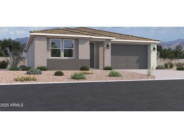 Charming single-story home with a two-car garage, desert landscaping, and a neutral color palette at 9548 W Parkway Dr, Tolleson, AZ 85353