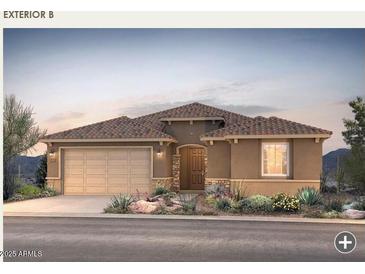 Charming home featuring a well-manicured front yard, desert landscaping, and a two-car garage at 17656 W Rancho Dr, Litchfield Park, AZ 85340