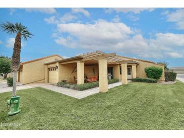 Inviting single-story home with covered patio and well-manicured lawn in a desirable neighborhood at 416 Leisure World --, Mesa, AZ 85206