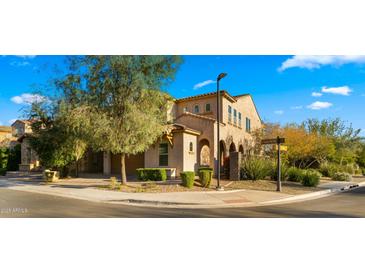 Attractive two-story home with a well-manicured front yard on a corner lot at 4611 E Casitas Del Rio Dr, Phoenix, AZ 85050