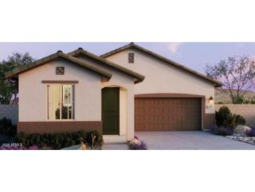 Charming single-story home with a two-car garage, manicured landscaping, and neutral exterior paint at 5640 S 253Rd Ave, Buckeye, AZ 85326