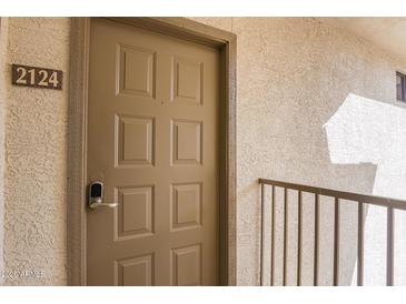 Condo unit door featuring a digital lock and the number 2124 displayed outside the unit at 6900 E Princess Dr # 2124, Phoenix, AZ 85054