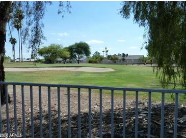 Scenic golf course view with lush greenery and mature trees at 12046 S 44Th St, Phoenix, AZ 85044