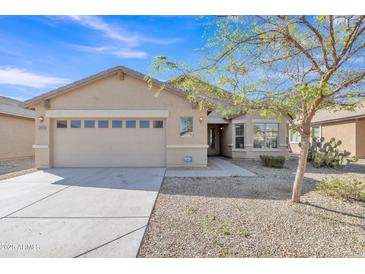 Charming single-story home featuring a two-car garage, desert landscaping, and a welcoming entrance at 3013 W Pollack St, Phoenix, AZ 85041