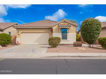 Charming single-story home featuring a two-car garage and low maintenance desert landscaping at 41304 W Rio Bravo Dr, Maricopa, AZ 85138