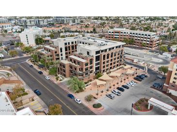 An aerial view of a contemporary condo complex boasting a central location, and stylish architecture at 7301 E 3Rd Ave # 101, Scottsdale, AZ 85251