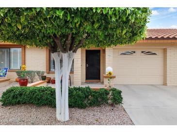 Charming single-story home with mature tree, low maintenance landscape, and inviting curb appeal at 7755 E Laguna Azul Ave # 184, Mesa, AZ 85209