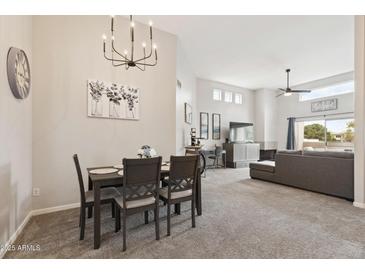 Inviting living space featuring dining area and an abundance of natural light from clerestory windows at 11260 N 92Nd St # 2025, Scottsdale, AZ 85260