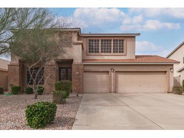 Two-story home featuring a two-car garage and well maintained landscape at 1805 E Sagebrush St, Gilbert, AZ 85296