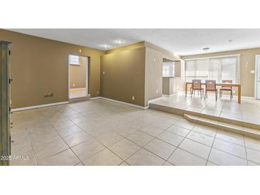 Spacious living room with tile floors and great natural lighting at 2348 W Laurel Ln, Phoenix, AZ 85029