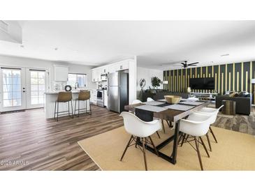 Open floor plan combines kitchen, dining, and living areas for seamless living at 4617 E La Puente Ave, Phoenix, AZ 85044
