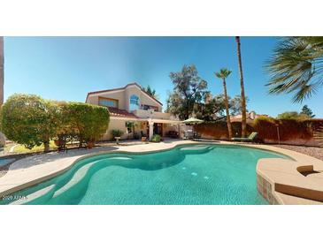 Gorgeous backyard pool and patio area, ideal for outdoor entertaining and relaxation at 6720 W Mcrae Way, Glendale, AZ 85308
