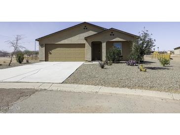 Charming single-story home with a two-car garage, desert landscaping and a covered front porch at 16010 S Elizabeth Pl, Arizona City, AZ 85123