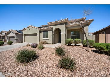 Charming single-story home featuring desert landscaping and a two-car garage at 4330 W Aracely Dr, New River, AZ 85087