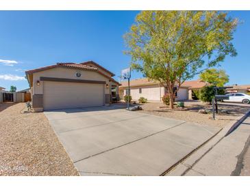 Charming single-story home with a long driveway and well-kept landscaping at 995 E Vernoa St, San Tan Valley, AZ 85140