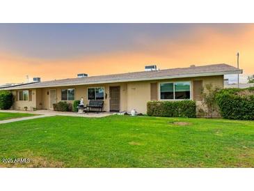 Charming single-story home with a well-manicured lawn and inviting curb appeal in a peaceful community at 11122 W Desert Butte Dr, Sun City, AZ 85351