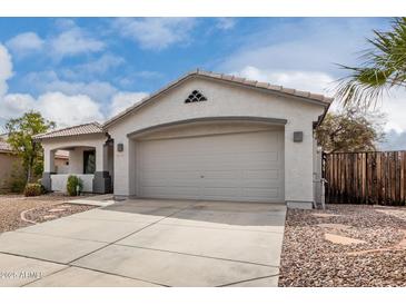 Charming single-story home featuring a large garage, well-kept landscape and a beautiful tiled roof at 3423 E Crescent Way, Gilbert, AZ 85298
