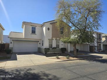 Two-story home featuring a low maintenance yard and attached two-car garage at 6527 W Adams St, Phoenix, AZ 85043