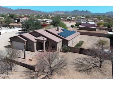 Attractive single-story home featuring solar panels and desert landscaping, offering energy efficiency and curb appeal at 37509 N 7Th N St, Phoenix, AZ 85086