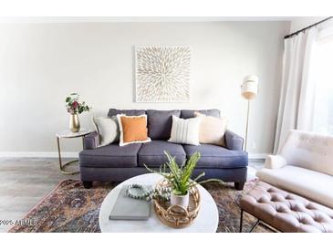 Cozy living room features a comfortable sofa, stylish decor, and a well-lit space at 4600 N 68Th St # 368, Scottsdale, AZ 85251