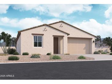Inviting single-story home featuring a neutral color palette, a two-car garage, and a well-manicured, drought-resistant landscape at 15784 W Beryl Ave, Waddell, AZ 85355